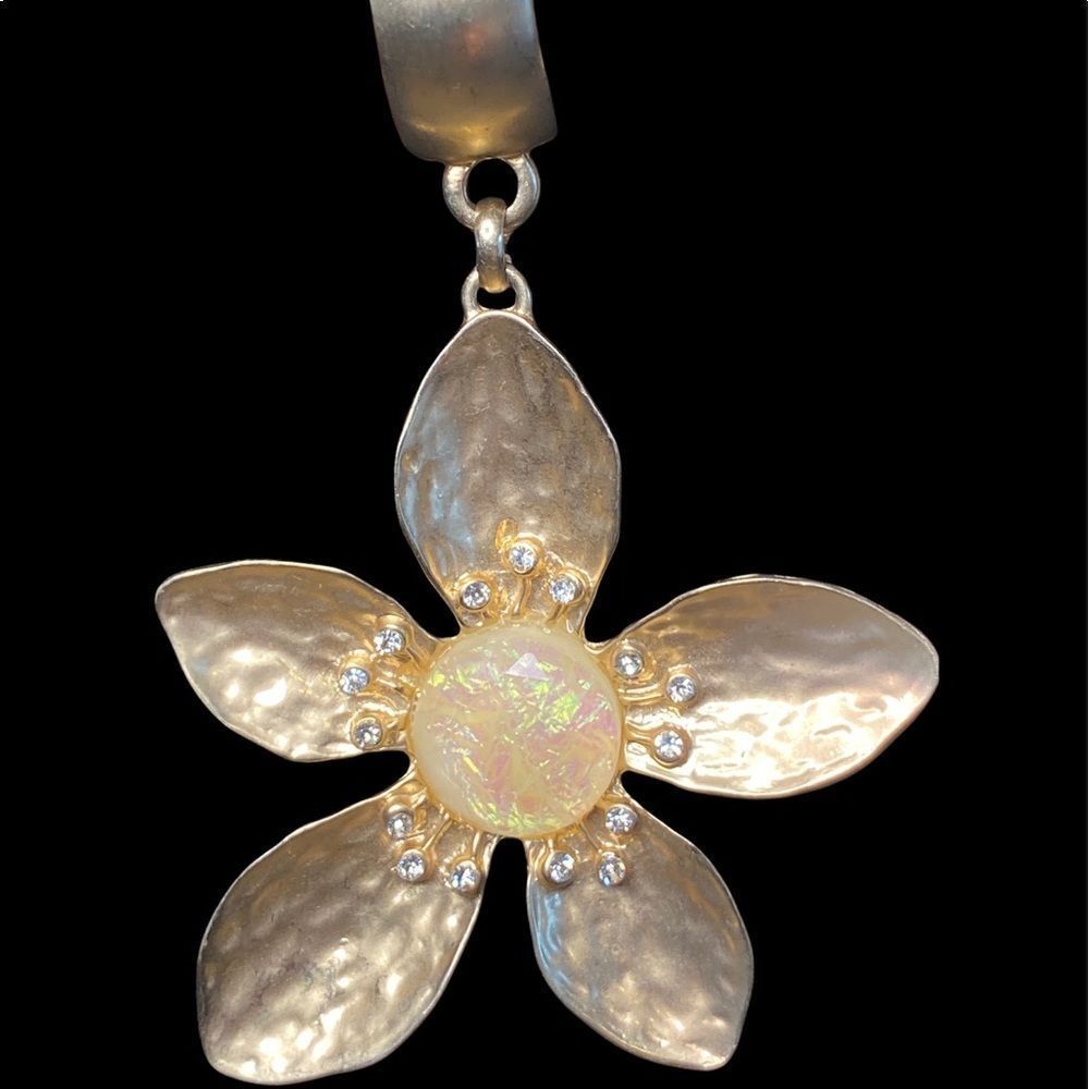 Gold tone flower scarf charm with rhinestones and opal like stone in center 3”